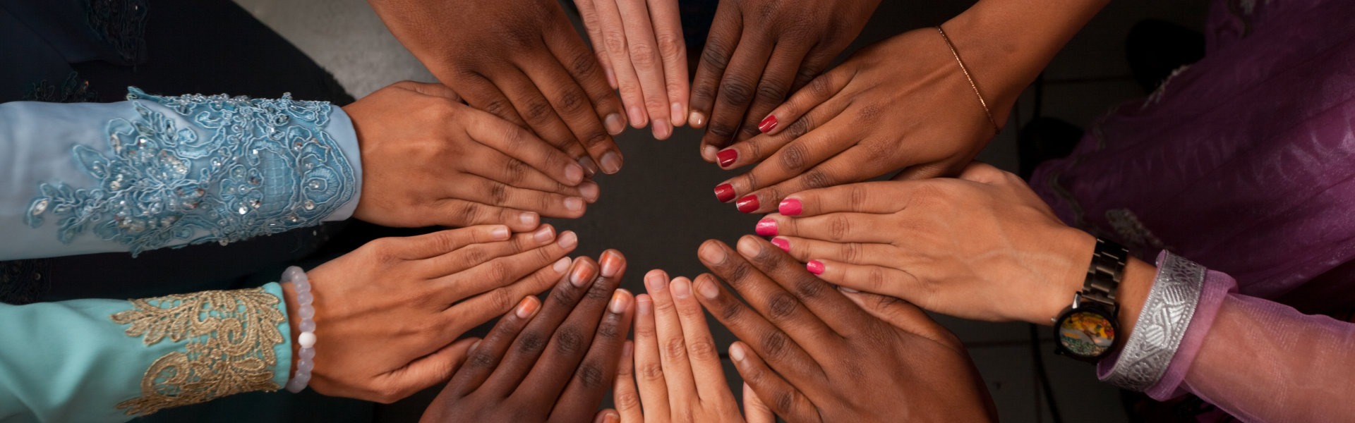 Hands of diverse group of people which stay together in circle